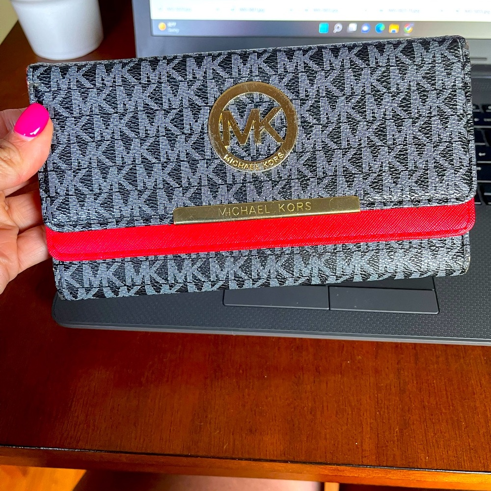 Michael Kors black and red multiple opening wallet new without tags never used.